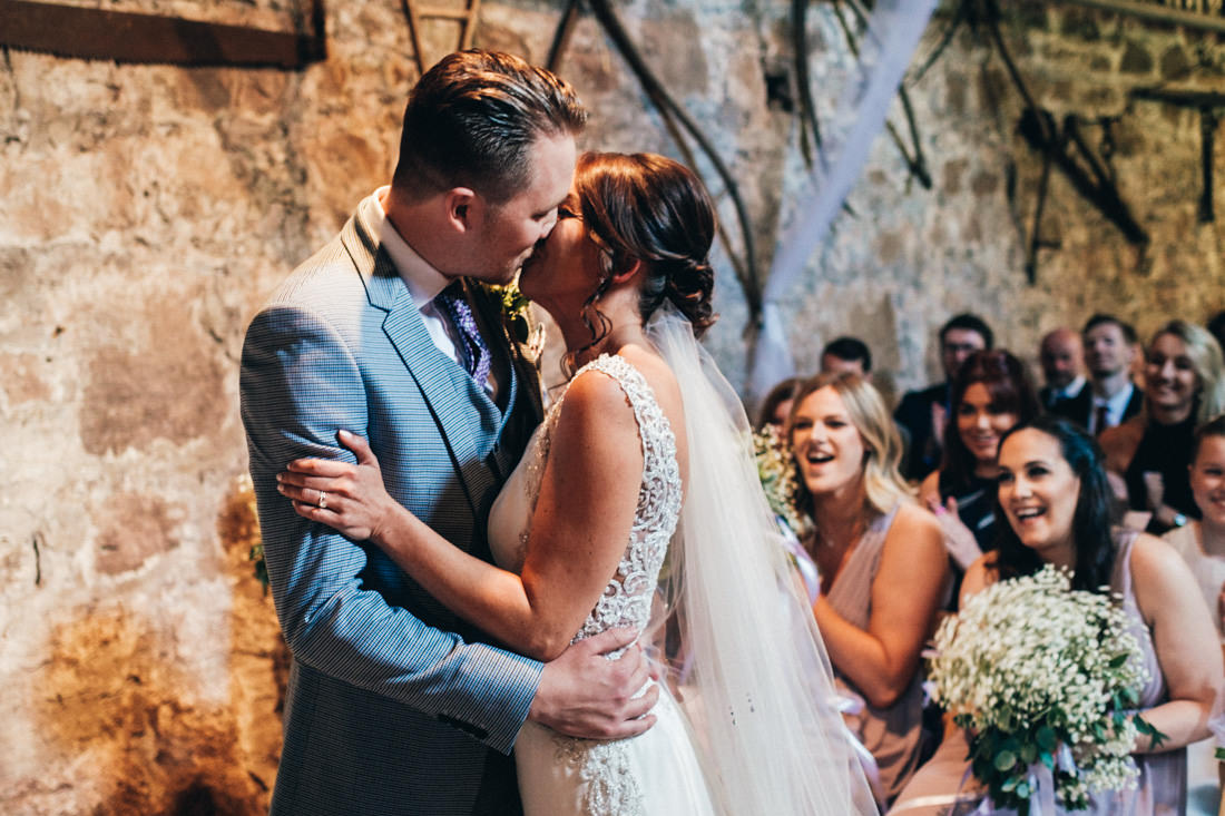 005 ROMANTIC FIRST KISS AS HUSBAND AND WIFE SUMMER BARN CEREMONY AT USK CASTLE WEDDING PHOTOGRAPHY 005 ROMANTIC FIRST KISS AS HUSBAND AND WIFE SUMMER BARN CEREMONY AT USK CASTLE WEDDING PHOTOGRAPHY